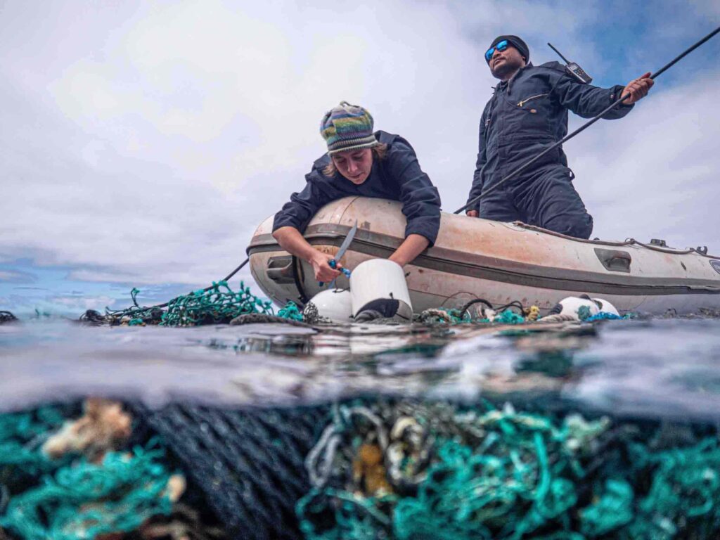 Crew Remove GPS tracker buoy from entagled nets